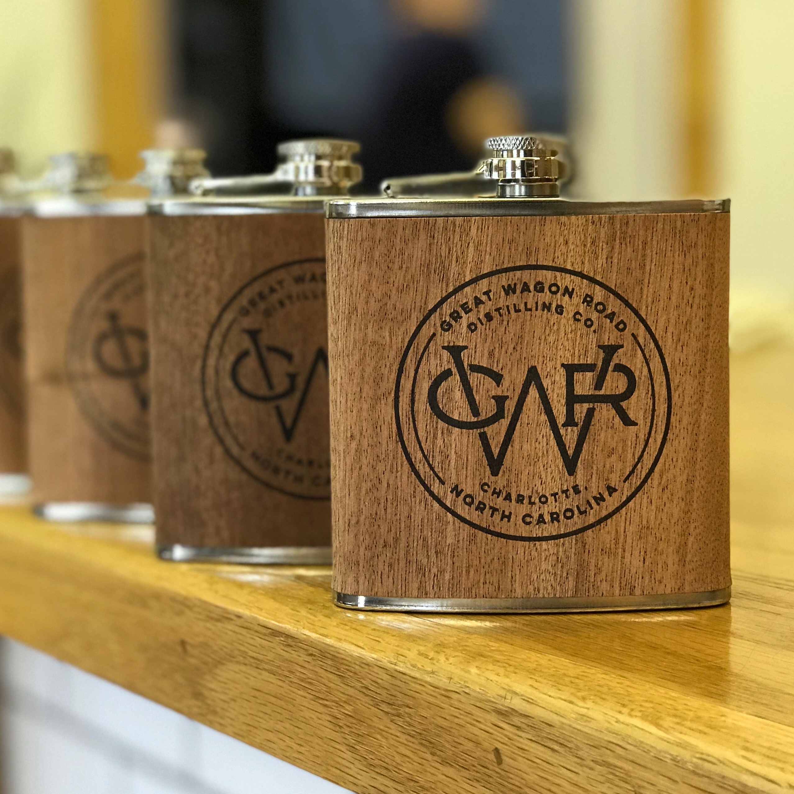 Great Wagon Road Distilling — Laser-engraved wood-wrapped promotional flasks